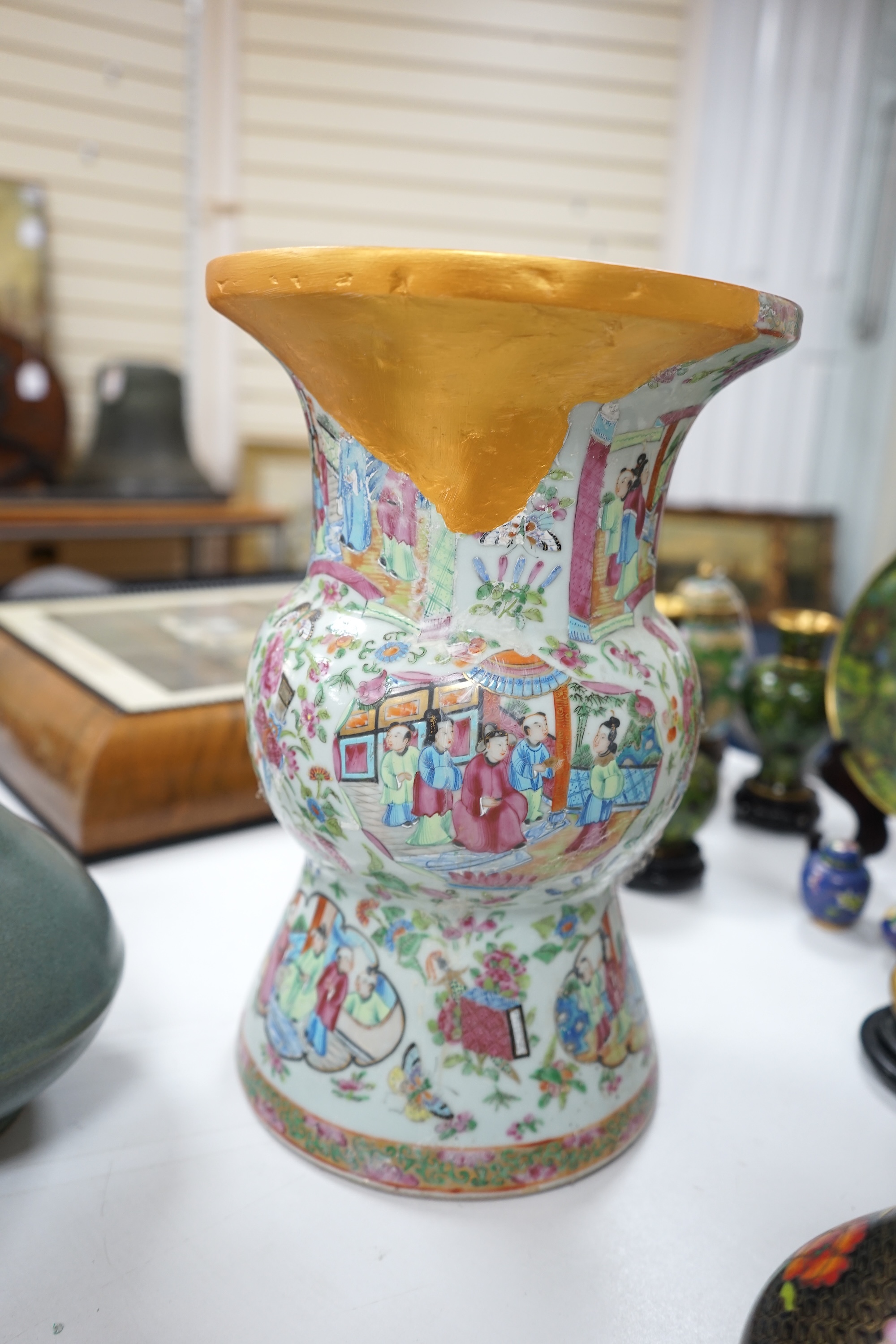 A large 19th century Chinese famille rose vase, a green glazed pear-shaped vase, and a blue and white dragon flask (3). Condition - poor to fair.